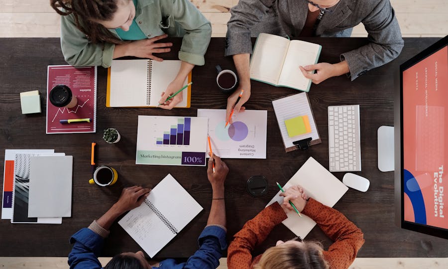 Top-down view of a project planning session with notes and charts