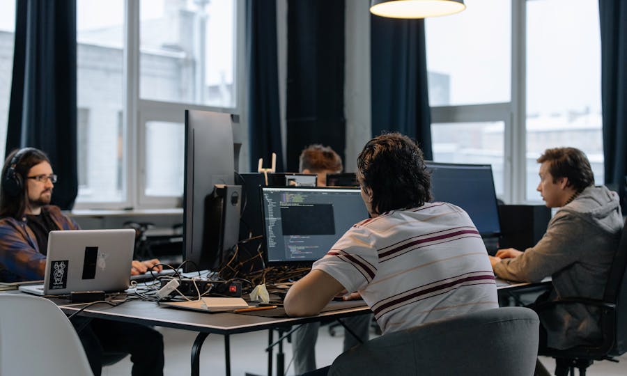 Software engineers collaborating in a modern office workspace